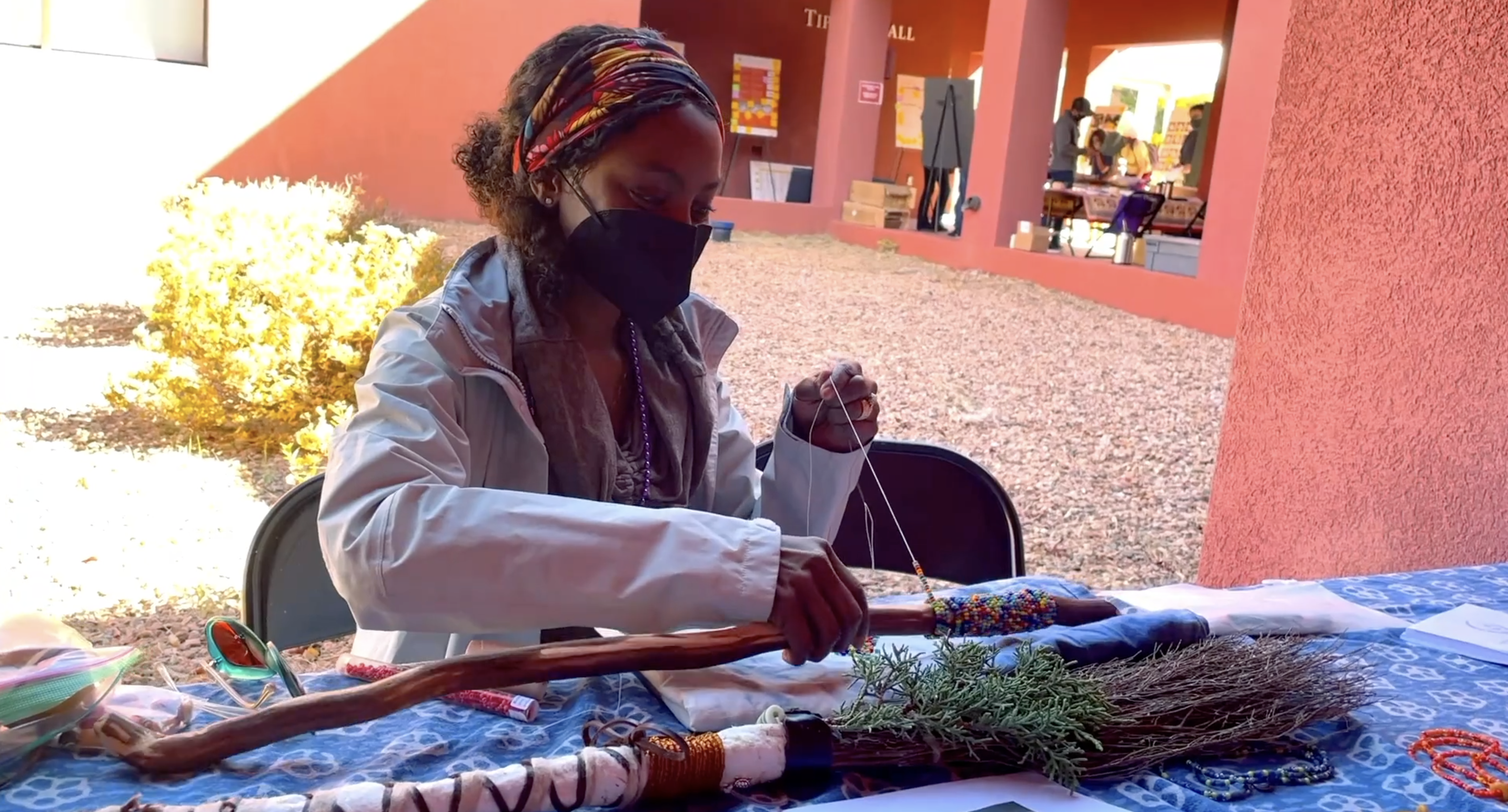 Woman doing beadwork